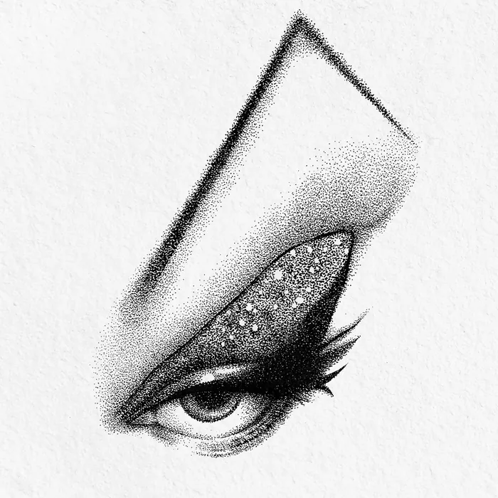 Close-up of a stylized eye with glitter and long eyelashes in black and white
