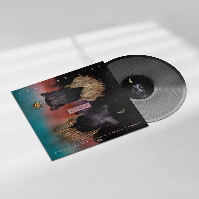 Vinyl record with album cover showing bears and flames artwork