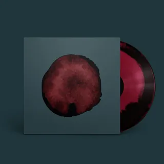 Vinyl record with a dark red circular abstract design on cover by Rino Pelli