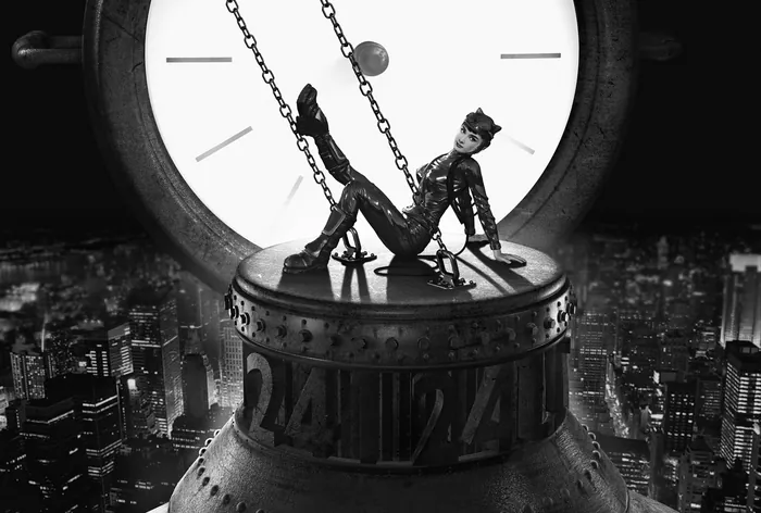 Black and white photo of woman on giant clock tower by RIVE GAUCHE