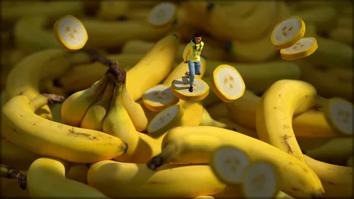 Miniature person standing on sliced bananas surrounded by whole bananas by RIVE GAUCHE