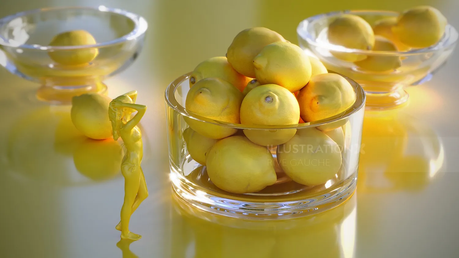 Glass bowls filled with lemons on a yellow reflective surface by RIVE GAUCHE