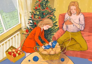 Woman and girl knitting by Christmas tree with craft supplies
