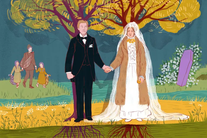 Bride and groom standing hand in hand outdoors with colorful trees.