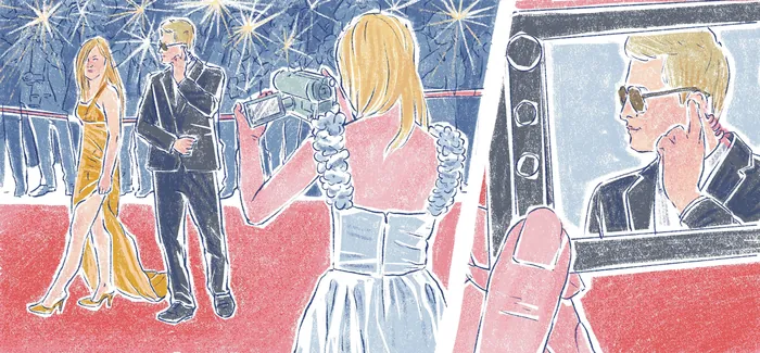 Photographers taking pictures of celebrities on red carpet