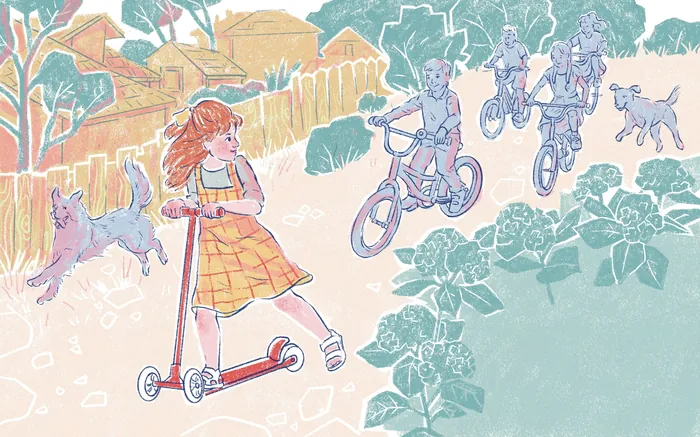 Girl on scooter and children on bicycles riding through neighborhood.