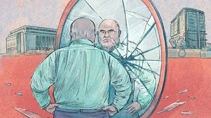 Man looking at cracked mirror reflecting his face outdoors