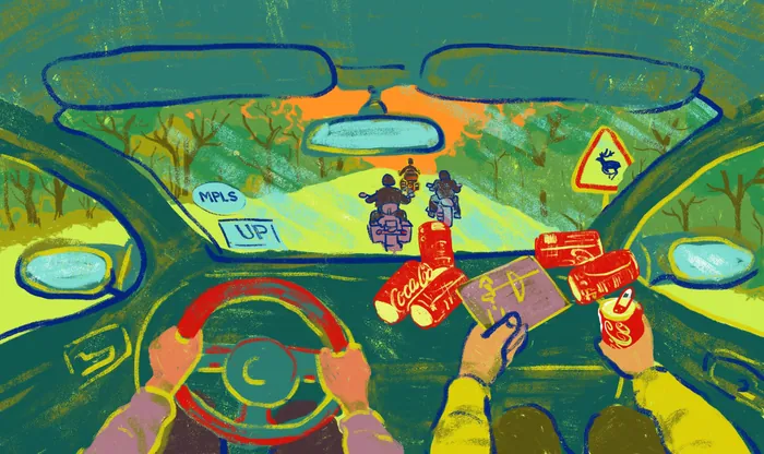 View from car interior showing two motorcyclists riding ahead on road