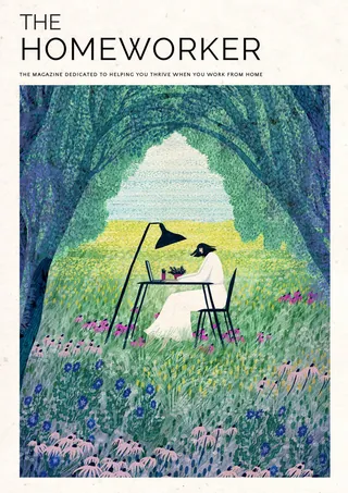 Person working at desk outdoors in a grassy, flower-filled area.