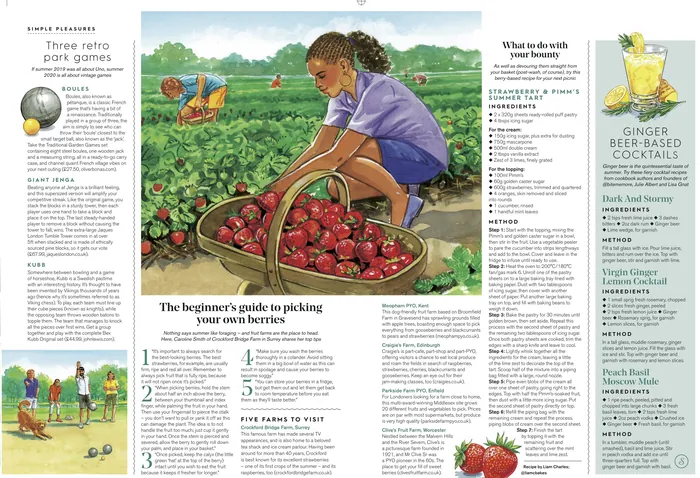 Girl picking strawberries in a green field under blue sky.