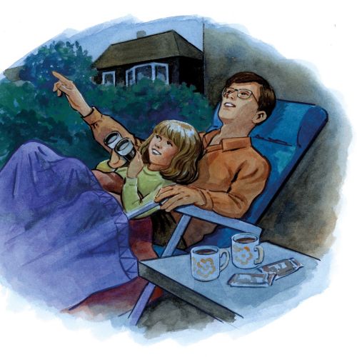 Father and daughter lying outside pointing at stars with mugs nearby