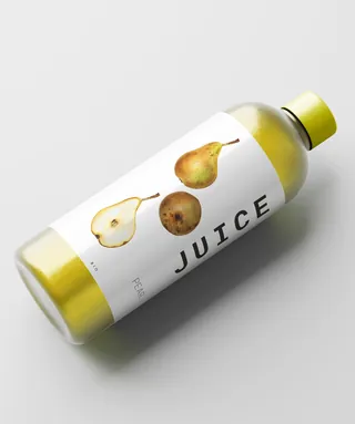 Clear bottle of pear juice with illustrated fruit label