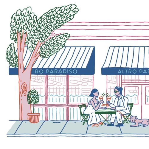 Couple dining outdoors at Altro Paradiso restaurant with a dog nearby