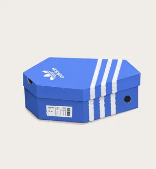Blue Adidas shoe box with white stripes by Samy Löwe