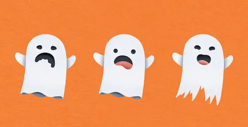 Three white cartoon ghosts with sad, surprised, and happy faces on orange