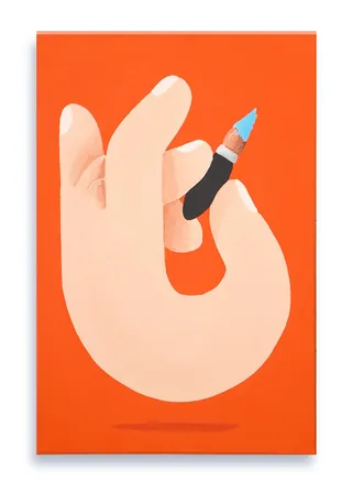Hand holding a tiny blue pen nib on an orange background