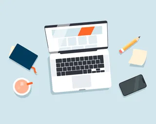 Workspace with laptop, smartphone, notebook, pencil, sticky notes, and coffee cup