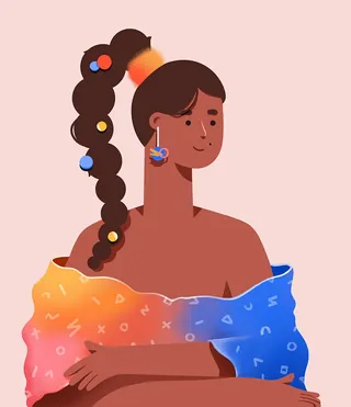 Woman with decorated ponytail wearing colorful shawl and earrings