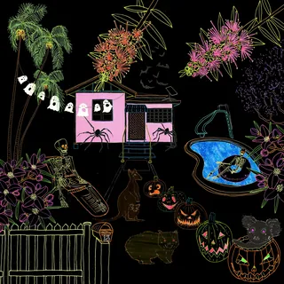 Halloween decorations with skeleton, jack-o-lanterns, and ghost lights outdoors