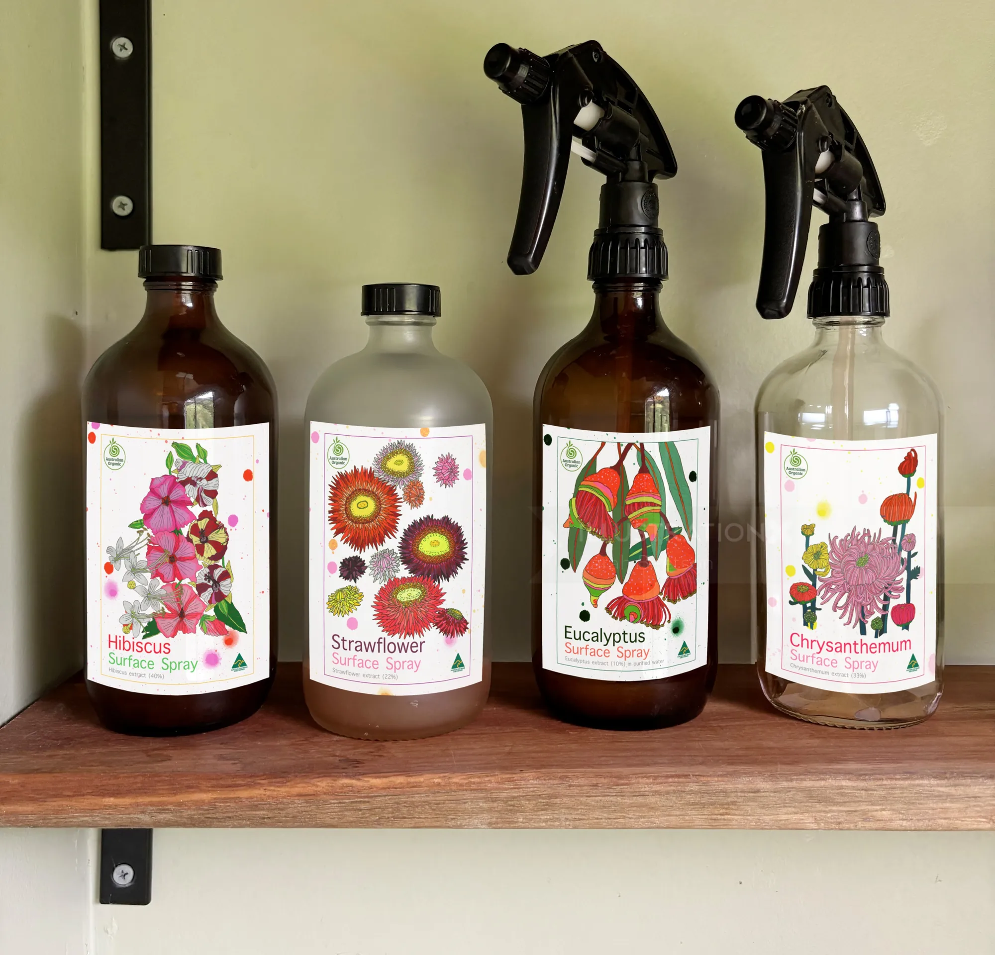 Spray bottles labeled hibiscus, strawflower, eucalyptus, chrysanthemum by Sarah Beetson