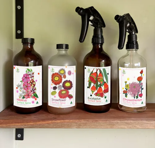 Spray bottles labeled hibiscus, strawflower, eucalyptus, chrysanthemum by Sarah Beetson