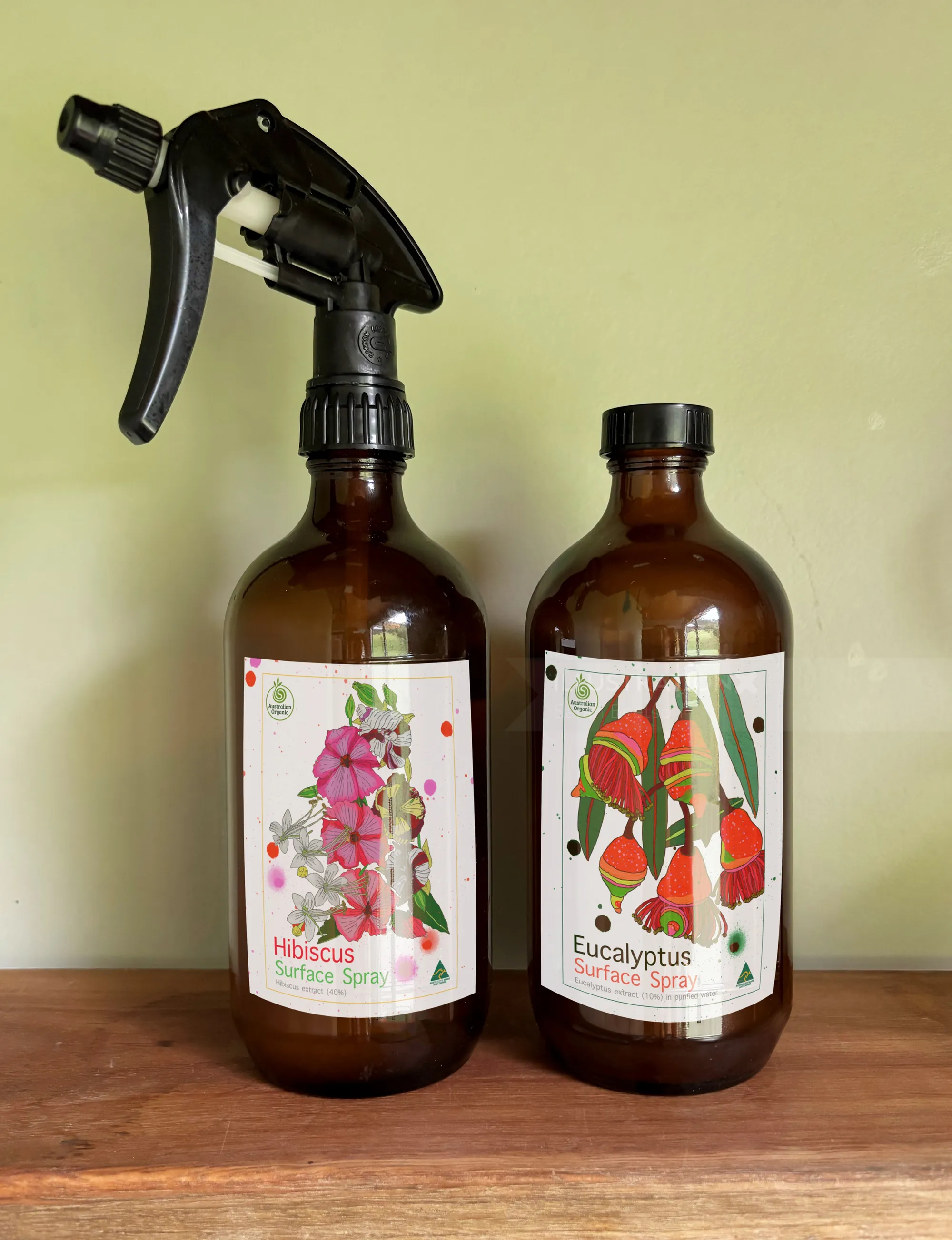 Spray bottles with hibiscus and eucalyptus labels by Sarah Beetson