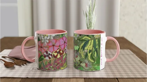 Two ceramic mugs with floral and leaf patterns by Sarah Beetson