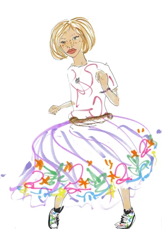 Girl dancing in colorful skirt with floral patterns