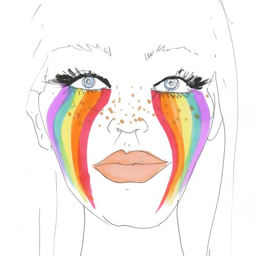Face with rainbow makeup streaks and freckles