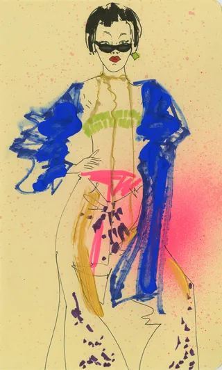 Stylish woman in sunglasses with blue coat and bright pink outfit