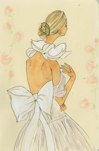 Woman in backless dress with large bow and soft floral background