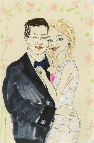 Elegant couple posing closely with floral background