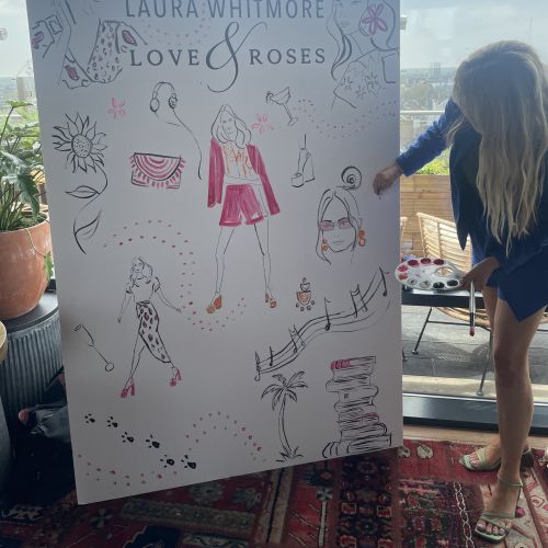 Person creating large live fashion illustration at event