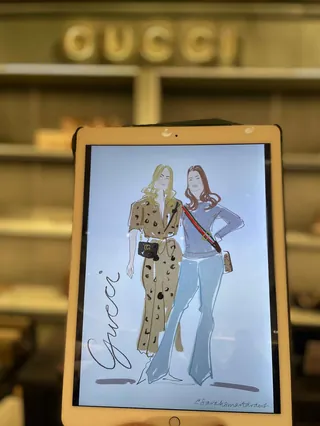 Digital fashion illustration of two women displayed on an iPad
