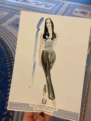 Fashion illustration of woman in striped top and black pants