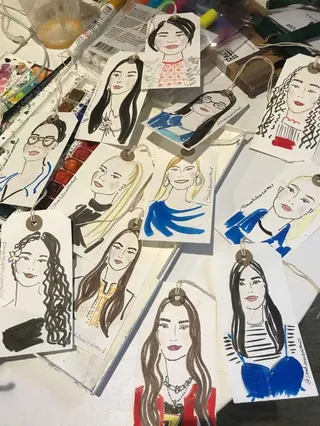 Hand-drawn live portrait illustrations on gift tags for Christmas