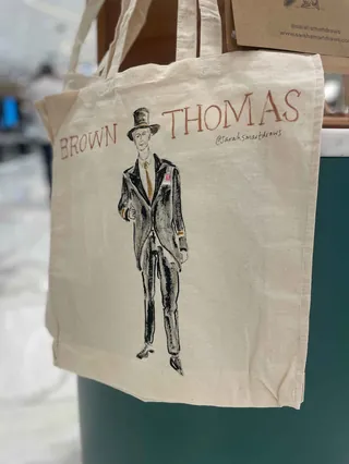 Canvas tote bag with Brown Thomas logo and illustration of a man in a suit