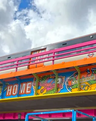 Colorful mural on Old Kent Road railway bridge with bright designs