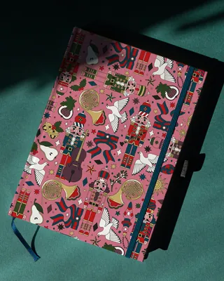 Christmas-themed notebook with nutcracker and festive pattern