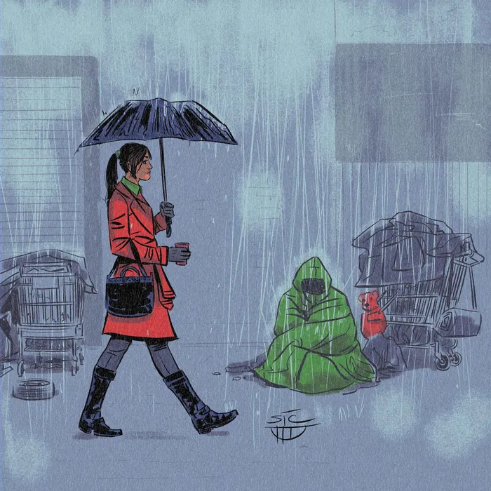 Woman walking in rain with umbrella past homeless person in green blanket