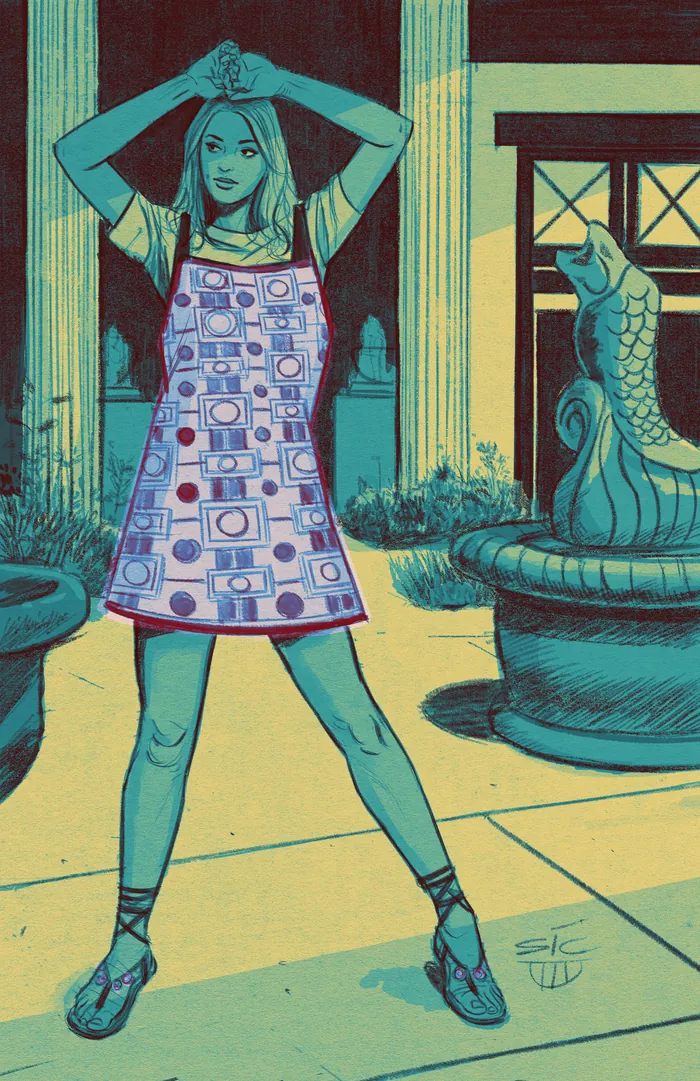 Woman wearing patterned smock in outdoor courtyard with fountain