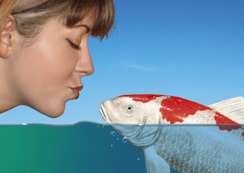 woman kissing koi fish