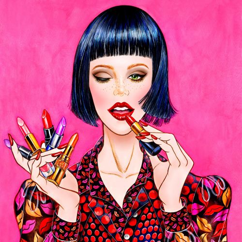 Portrait of a woman applying lipsticks