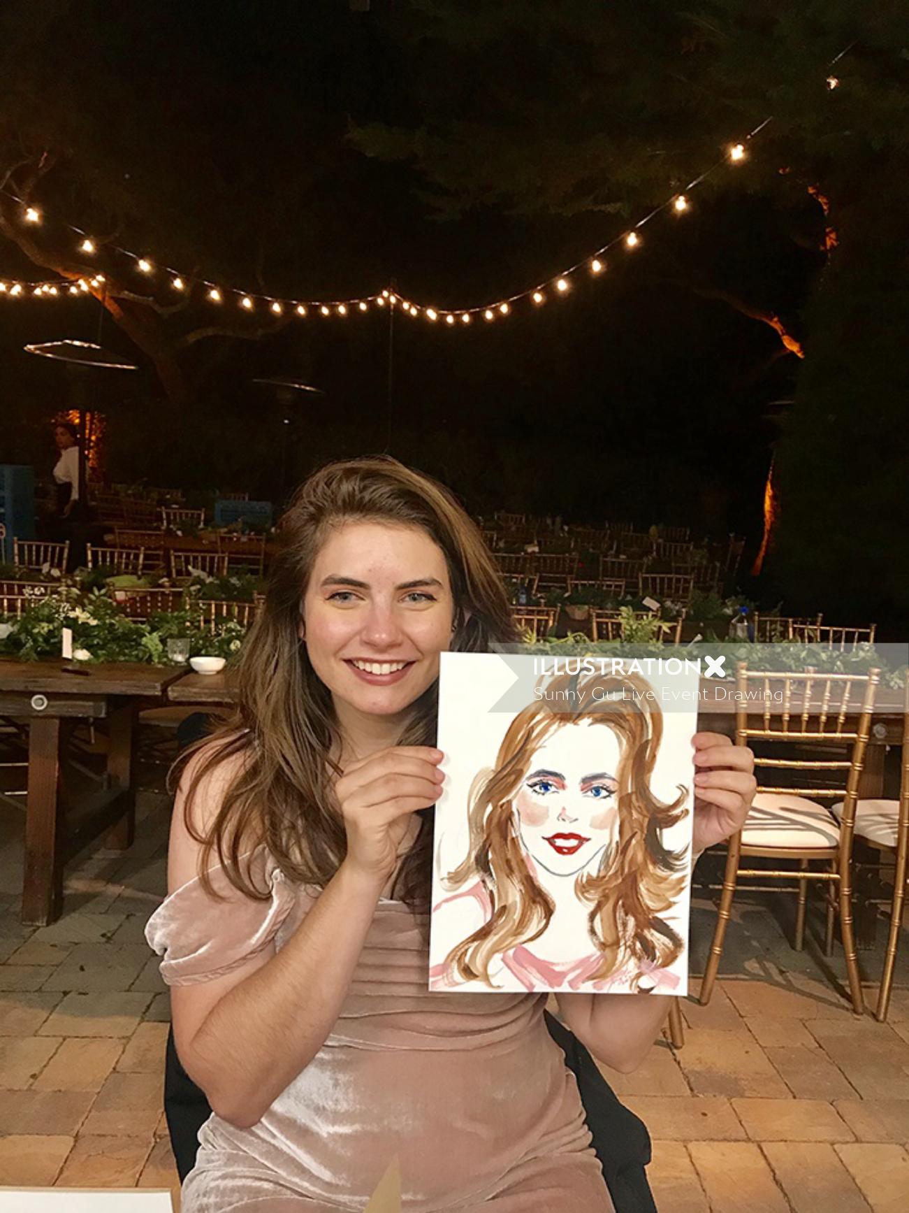 Live event drawing of woman with her painting

