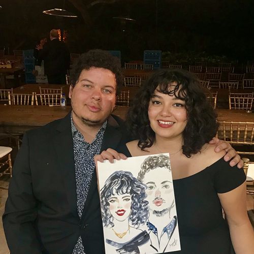 Live event drawing of couple in black dress
