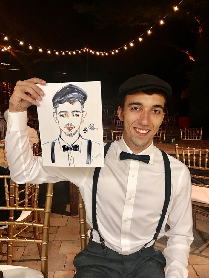Live event drawing of man in with portrait
