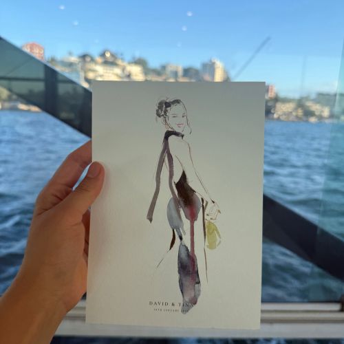 Fashion illustration held by hand by artist Sunwoo Mansour with Sydney waterfront background