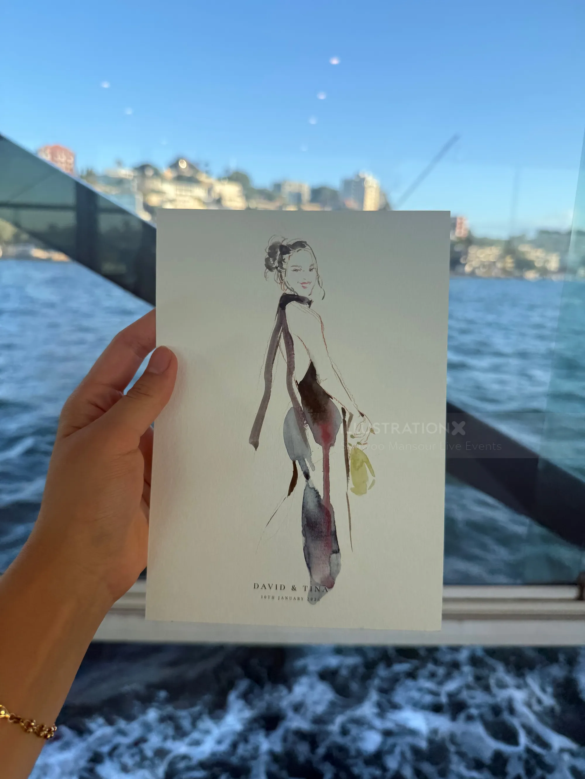 Fashion illustration held by hand by artist Sunwoo Mansour with Sydney waterfront background