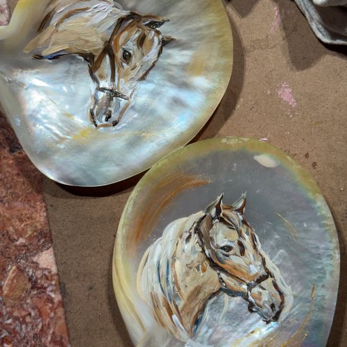 Hand-painted horse portraits on mother-of-pearl shells by Sunwoo Mansour