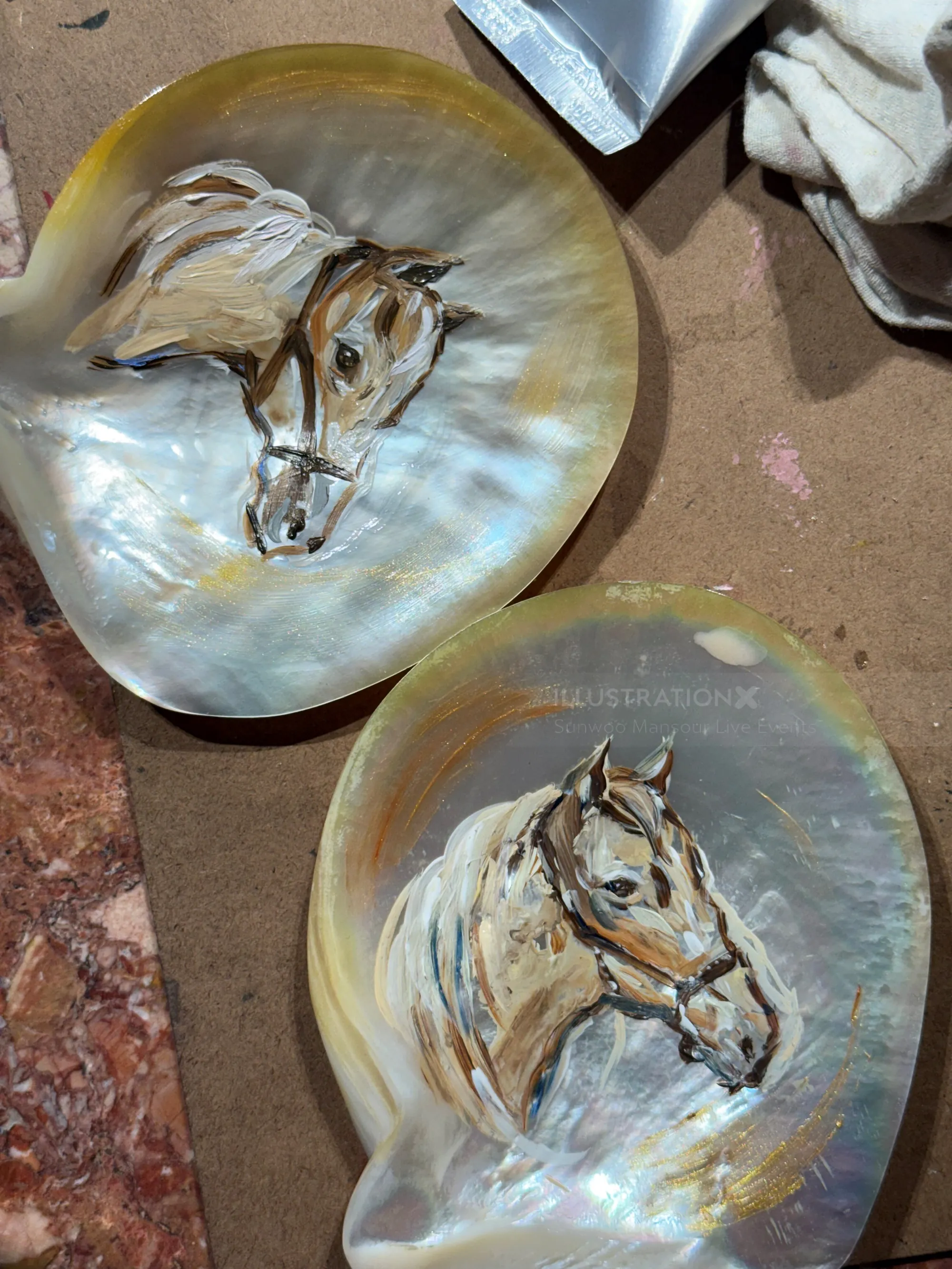 Hand-painted horse portraits on mother-of-pearl shells by Sunwoo Mansour